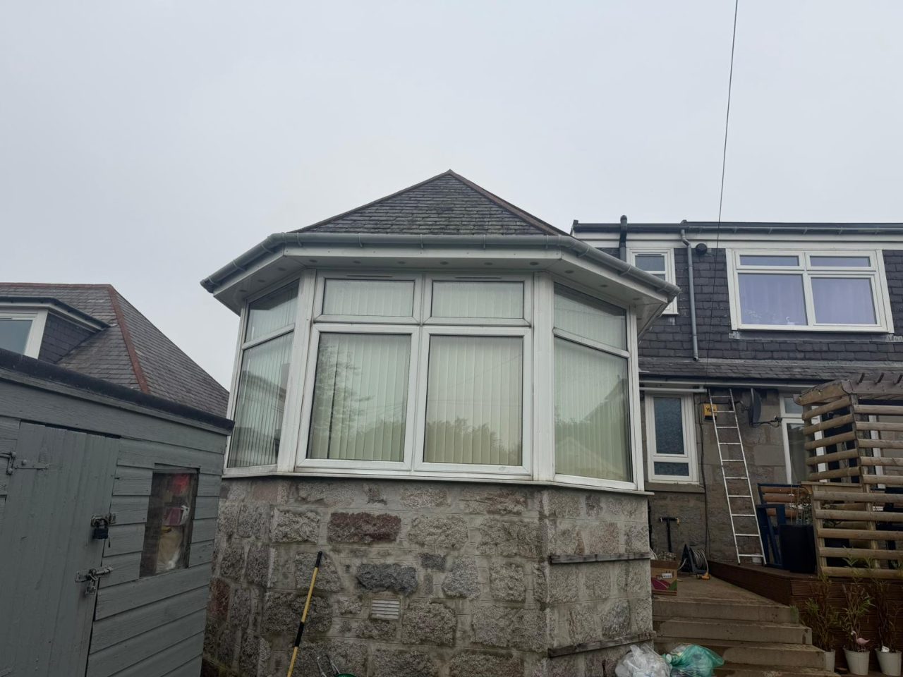 PVC roofline and bay window on a granite property