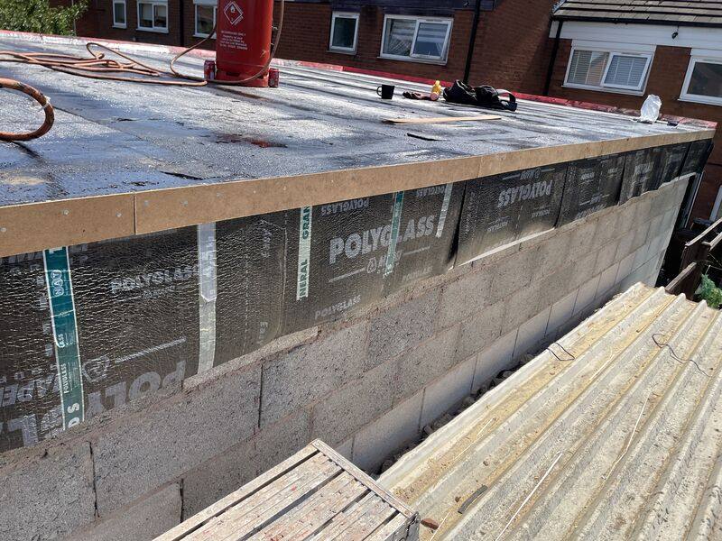 Polyglass membrane and upstand detail work on a flat roof