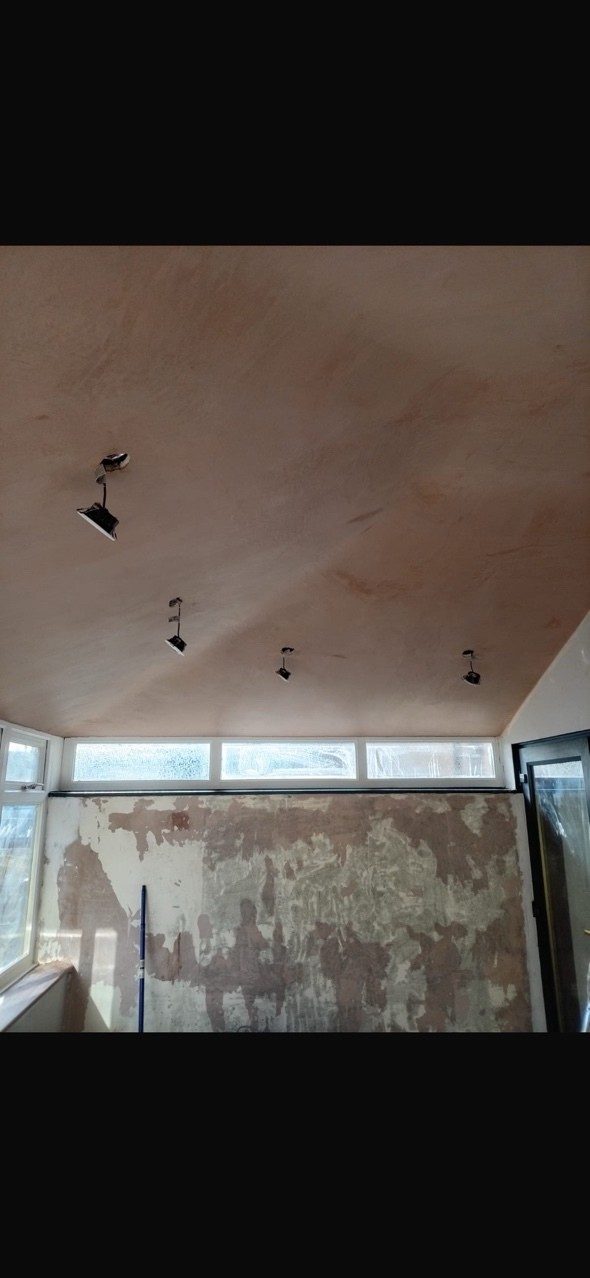 Freshly skimmed ceiling with recessed spotlights