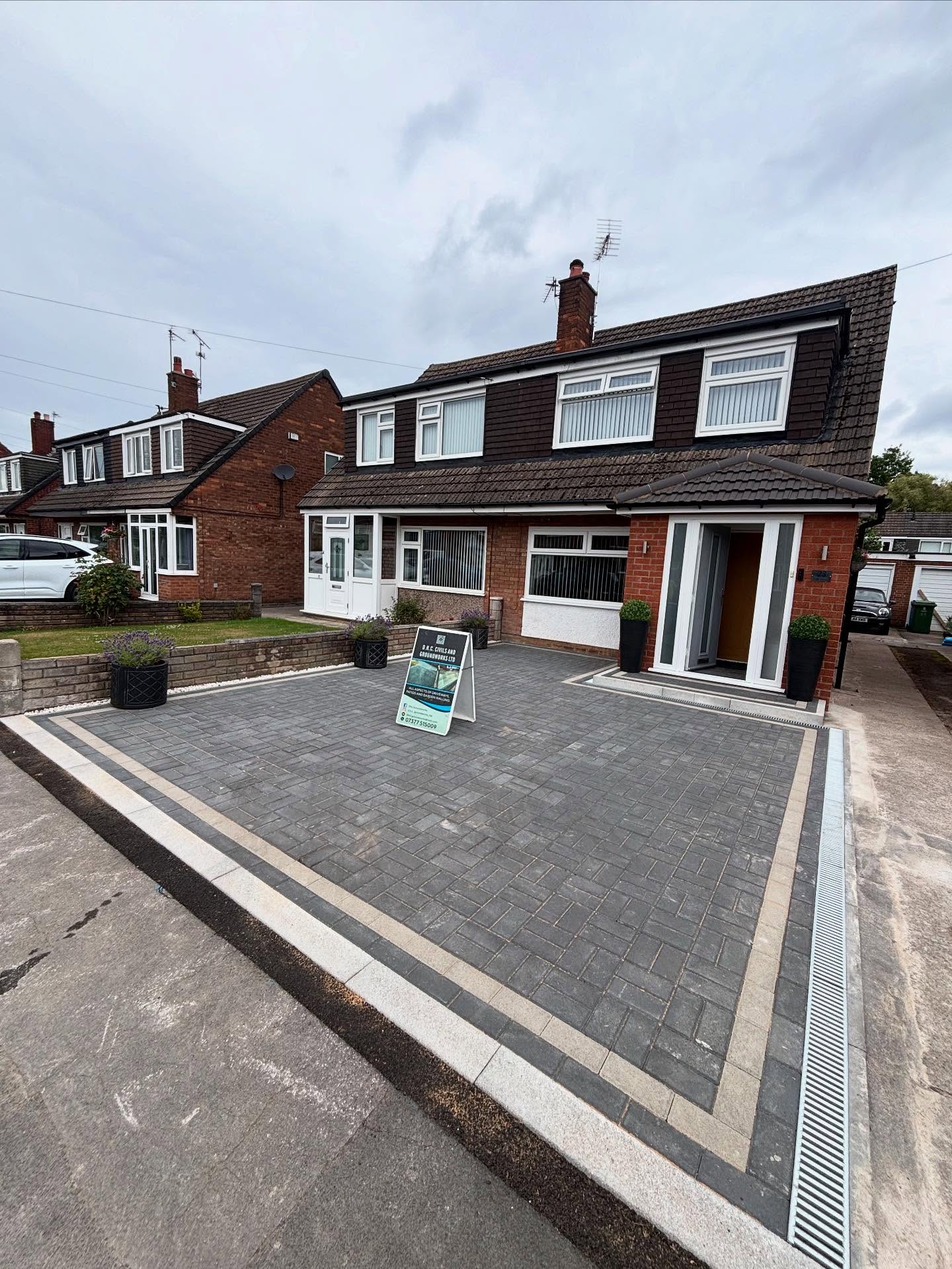 48 sqm charcoal Pedestra block driveway with natural border