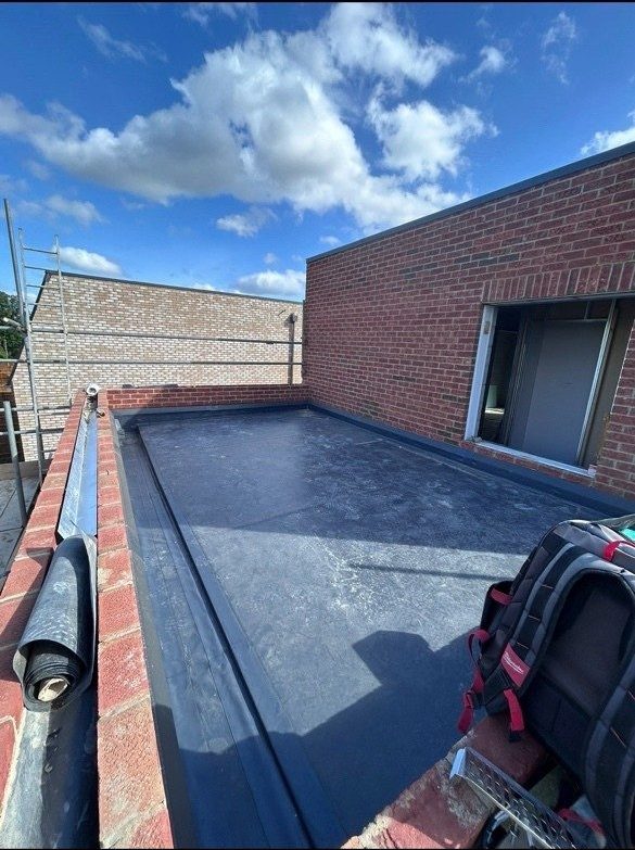 Single ply flat roof, brick extension