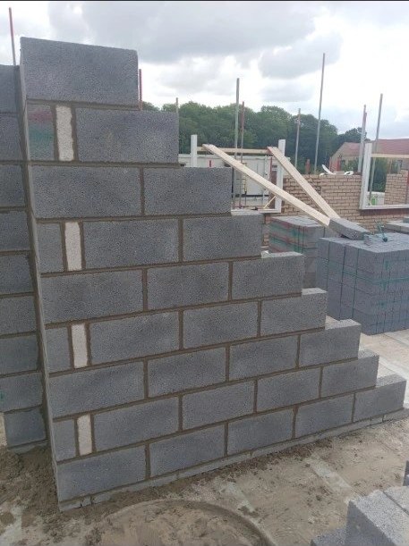 Grey blockwork wall on a new build site