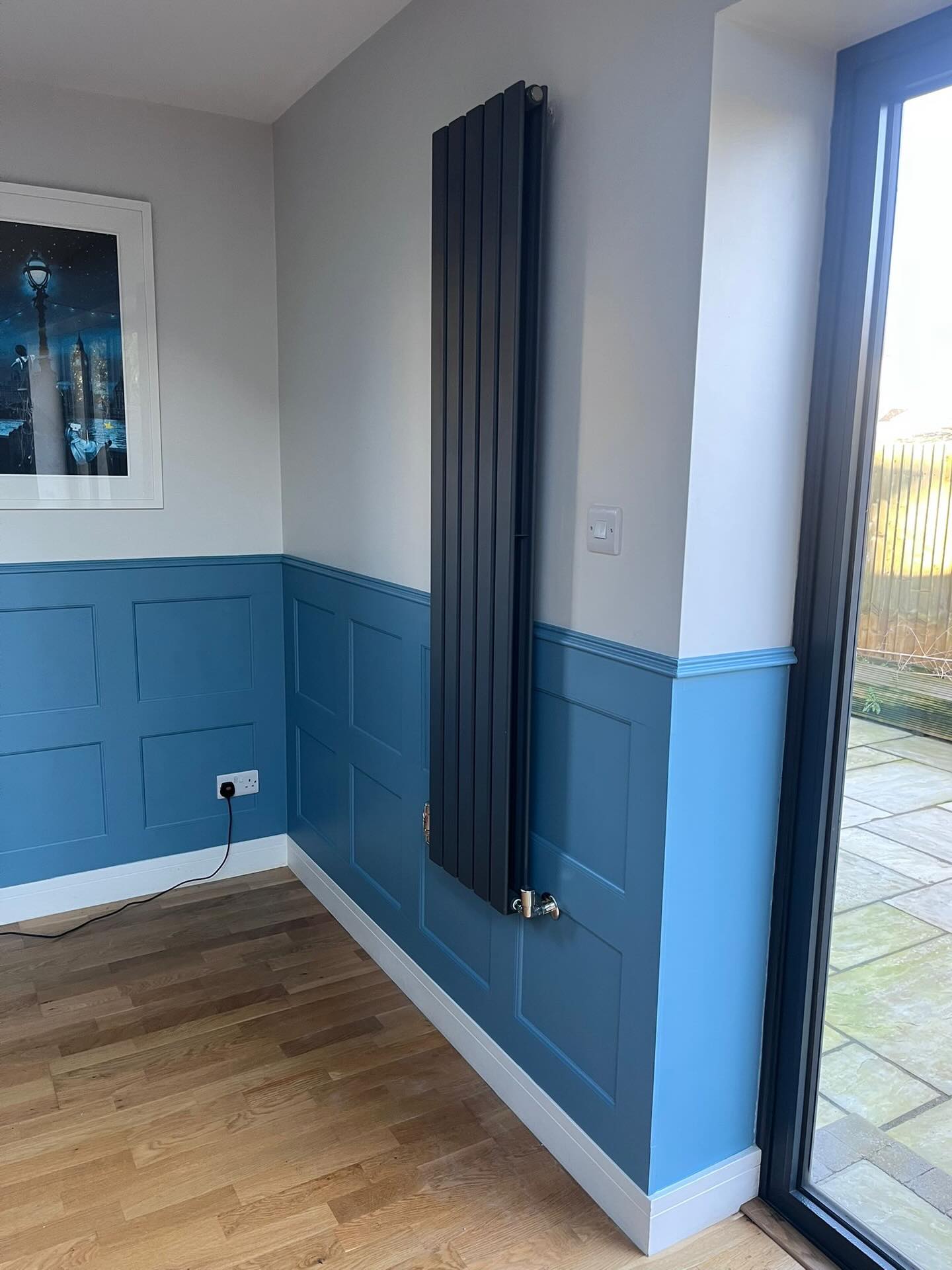 Painted panelled wall in a hallway