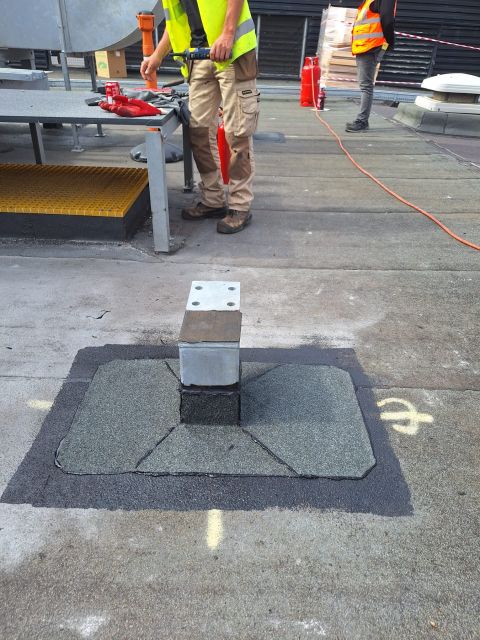 Steel penetration sealed, felt roof
