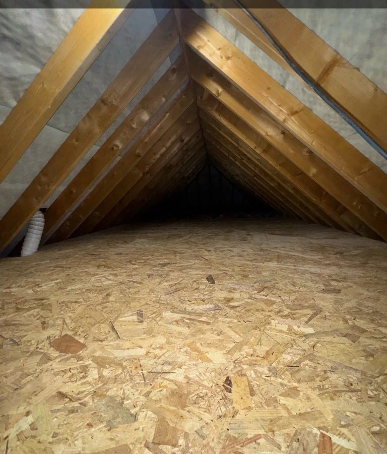 Freshly boarded loft with raised storage over new insulation