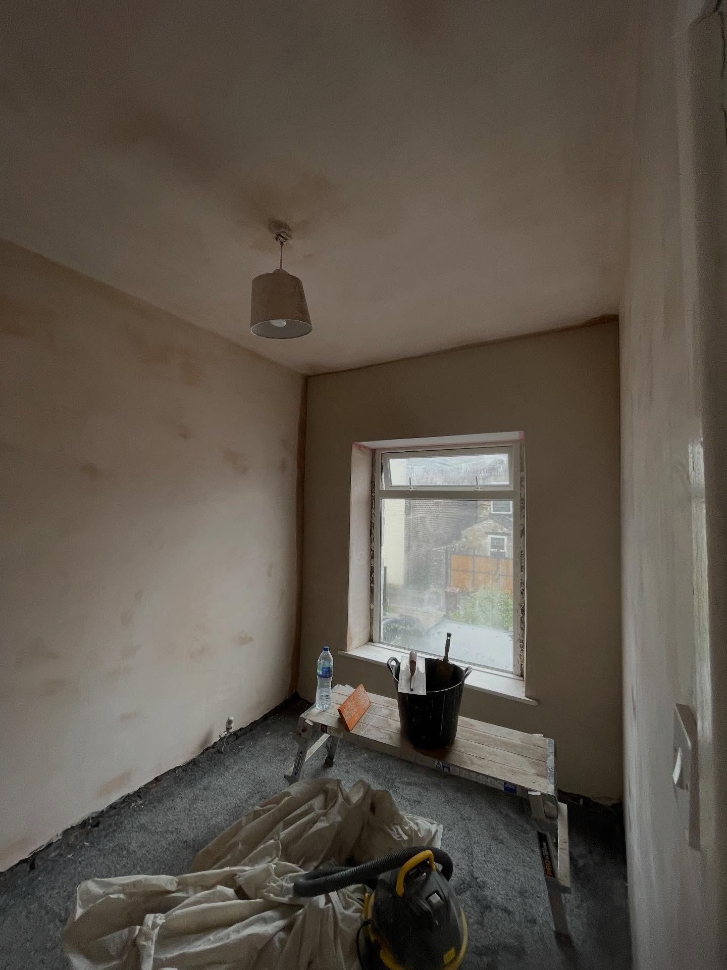 Bedroom freshly re-skimmed with the window wall in lime