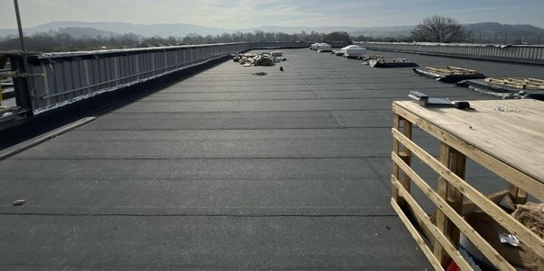 Single ply flat roof installed across a domestic extension
