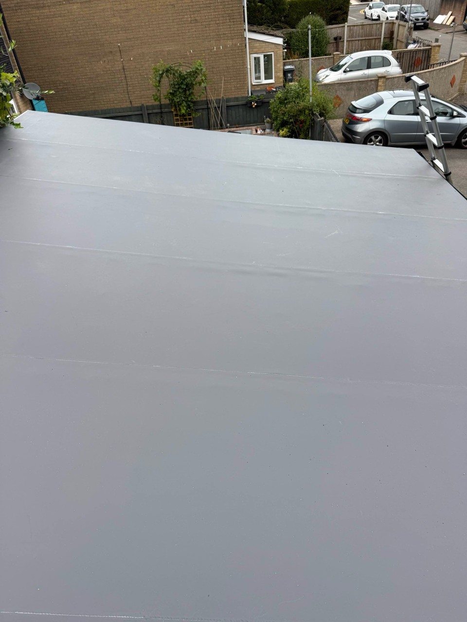 Neatly finished flat roof with edge trims and outlets