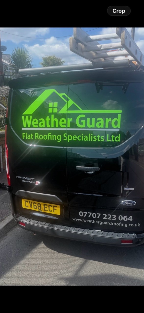 The branded Weather Guard Flat Roofing Specialists van